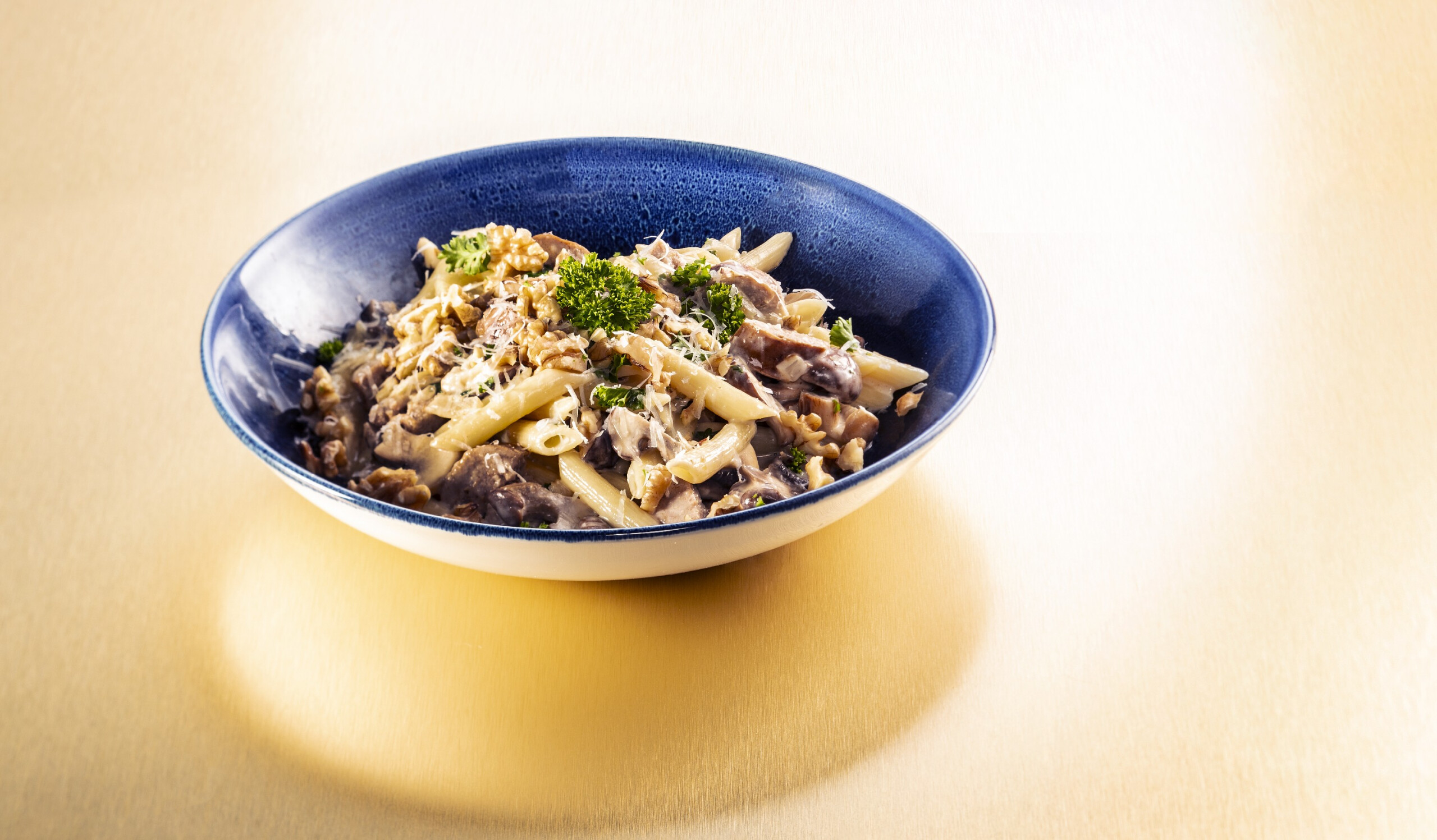 Penne met paddenstoelen en walnoten